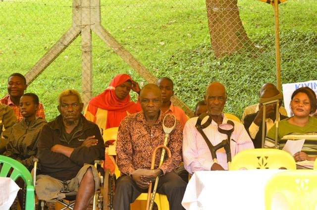 Community members seated together, some with walking aids, during an RDAF session.